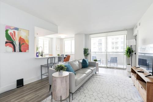 a living room with a couch and a table at 2BR Luxury Apartment Near DC & Airport in Arlington
