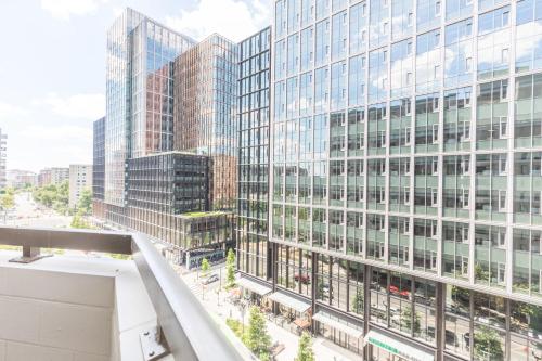 an aerial view of a city with tall buildings at Elegant 2BR Apartment Minutes From DC in Arlington