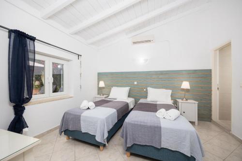 Postel nebo postele na pokoji v ubytování Levrecchio Beach Cottage