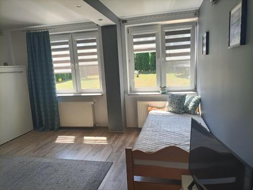 Posteľ alebo postele v izbe v ubytovaní Apartament Blekit Nieba