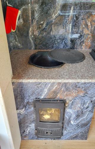 a tv sitting on top of a counter at Villa, pool and relax for 12 persons in Kuti