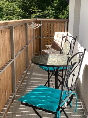 a patio with a table and a chair at Luxury Apart near Lake Bohinj in Bohinj