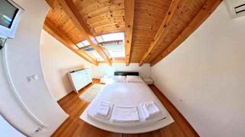 a bedroom with a bed in a room at Villa Apartments Mecajac in Cavtat