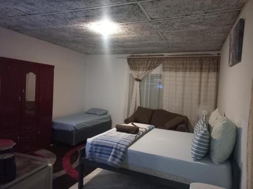 Ένα ή περισσότερα κρεβάτια σε δωμάτιο στο Olikaya Guest House Groblersdal