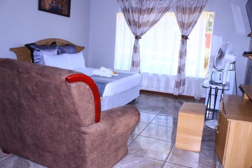 Ένα ή περισσότερα κρεβάτια σε δωμάτιο στο Olikaya Guest House Groblersdal