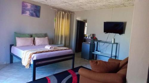 Ένα ή περισσότερα κρεβάτια σε δωμάτιο στο Olikaya Guest House Groblersdal
