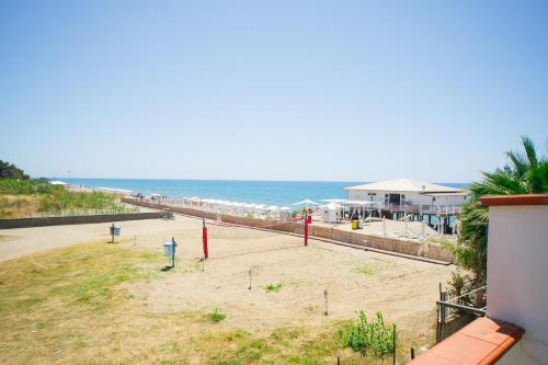 a view of a beach with the ocean in the background at Le terrazze sulla spiaggia in Ascea