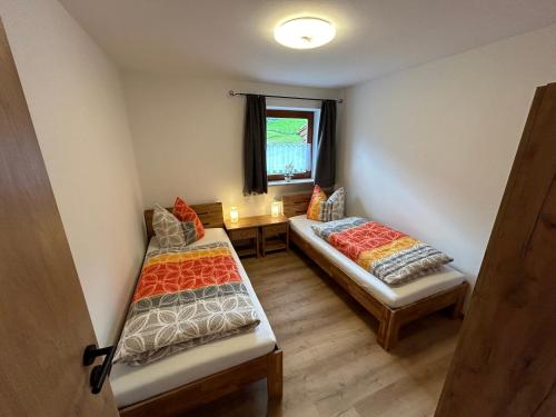 Ліжко або ліжка в номері Ferienwohnung Alpenblick