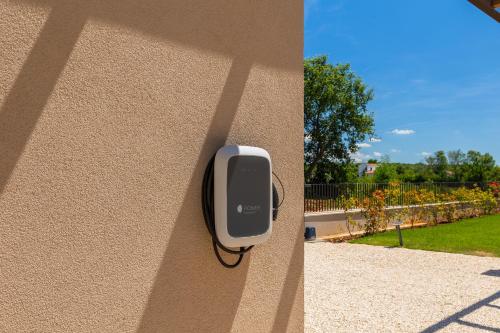 a security device is attached to the side of a wall at Beautiful Villa Vegt with pool in Labinci in Labinci