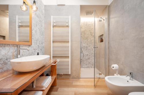 a bathroom with a sink and a shower at B&B Le Molinare Home Relax in Varda