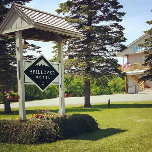 a sign in a yard with a gazebo at Spillover Motel and Inn in Stratton