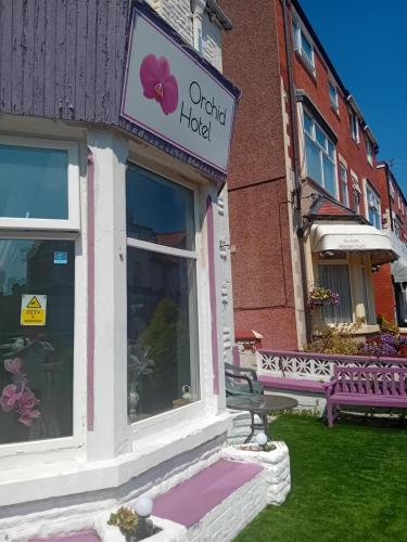 a building with a sign that reads official hotel at MyRoomz Orchid Hotel in Blackpool