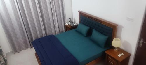 Ένα ή περισσότερα κρεβάτια σε δωμάτιο στο Sweet Home Ja-Ela
