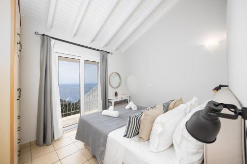 Ένα ή περισσότερα κρεβάτια σε δωμάτιο στο Villa Jasmine