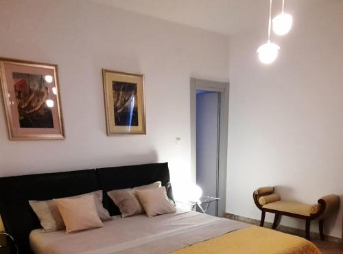 a bedroom with a bed and a chair at Apartment Stella Casa Bruno in Vrsi