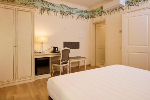 Ένα ή περισσότερα κρεβάτια σε δωμάτιο στο Hotel Art Atelier - Place of Charme