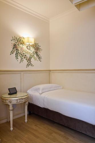 Ένα ή περισσότερα κρεβάτια σε δωμάτιο στο Hotel Art Atelier - Place of Charme