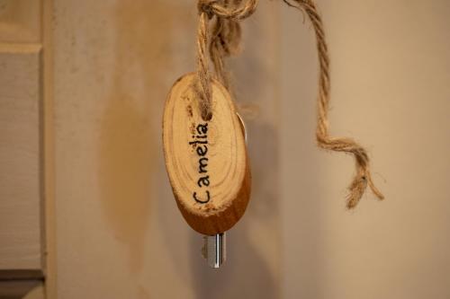 a wooden spoon is hanging on a wall at La Locanda di Villa Toscana in Bibbona