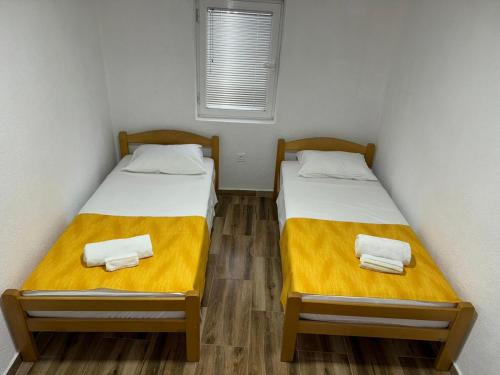 Postel nebo postele na pokoji v ubytování RiO Apartmani
