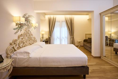 Ένα ή περισσότερα κρεβάτια σε δωμάτιο στο Hotel Art Atelier - Place of Charme