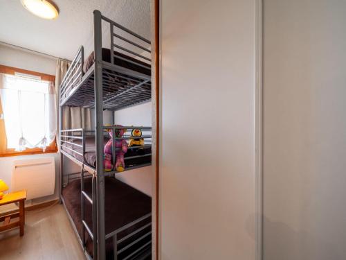 a walk in closet with bunk beds in a room at Apartment Bâtiment A-18 by Interhome in Le Corbier