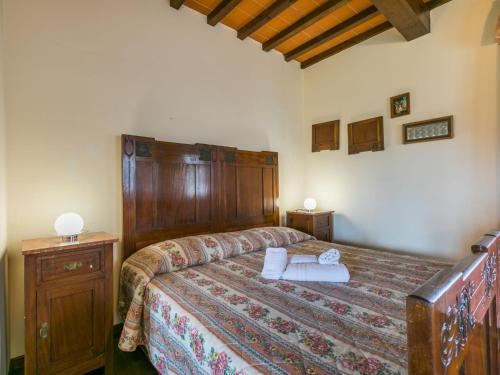 a bedroom with a bed with two towels on it at Villa Villa Elena-1 by Interhome in Le Vedute
