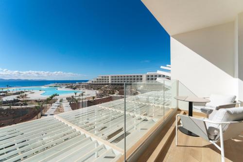 a balcony with a view of the ocean at Barceló Playa Blanca in Playa Blanca