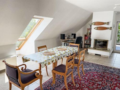 a dining room with a table and chairs at Apartment Carola by Interhome in Godern