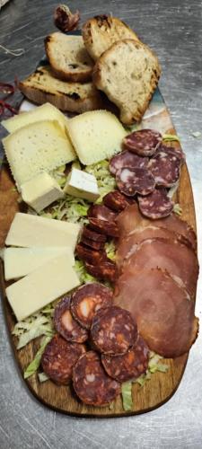 a plate of food with meat and cheese and bread at Hotel Ristorante Antica Marina in Nicotera Marina
