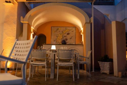 a restaurant with a table and chairs in an archway at Hotel Chiaia Di Luna in Ponza