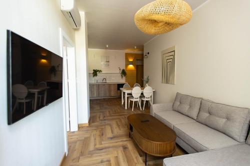 a living room with a couch and a table at Apartamenty Rynek 12 in Tarnów