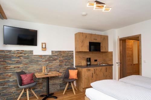 Μια τηλεόραση ή/και κέντρο ψυχαγωγίας στο Appartement Auszeit -408-