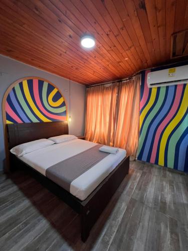 Ένα ή περισσότερα κρεβάτια σε δωμάτιο στο Hotel Puerto Colombia