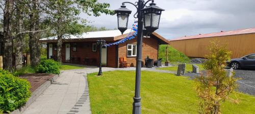 a street light in front of a house at Country Dream - Langholt 2 in Selfoss