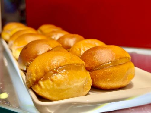 a plate of doughnuts sitting on a table at Kastel Manibu Recife - Boa Viagem in Recife