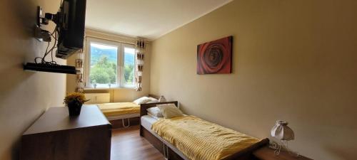 Posteľ alebo postele v izbe v ubytovaní APARTAMENT RELAX