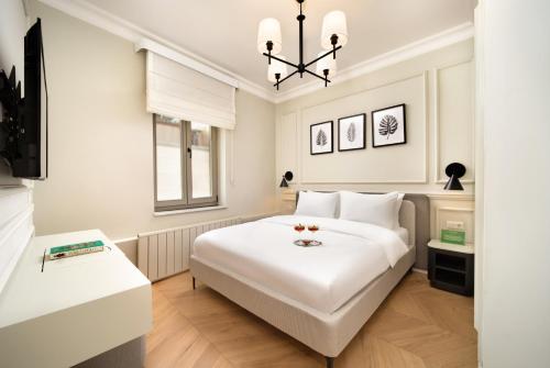 Postel nebo postele na pokoji v ubytování Vucino Suites
