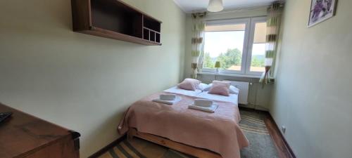 Ένα ή περισσότερα κρεβάτια σε δωμάτιο στο APARTAMENT RELAX