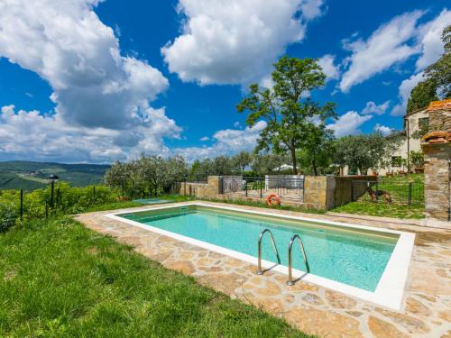 a swimming pool in the yard of a villa at Apartment Padronale by Interhome in Greve in Chianti