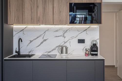 a kitchen with a sink and a counter top at Apartments Ivan in Baška Voda