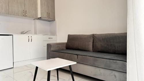 a living room with a couch and a table at Sublime studio nr3 in Ulcinj