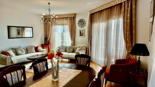 a living room with a table and a couch at Panorama Bar 2 bedroom in Bar