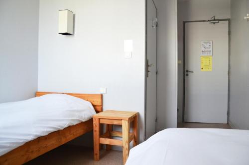 Postel nebo postele na pokoji v ubytování Auberge La Digue