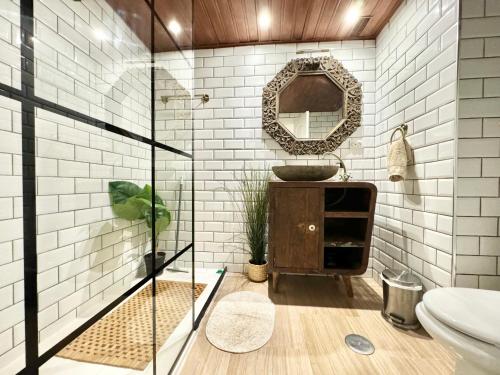 a bathroom with a sink and a mirror at Simply Astonishing Location in Benalmádena