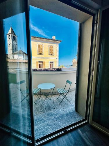 a view of a table and chairs from a window at Hotel Al Campanile - Luxury Suites & Apartments in Baveno