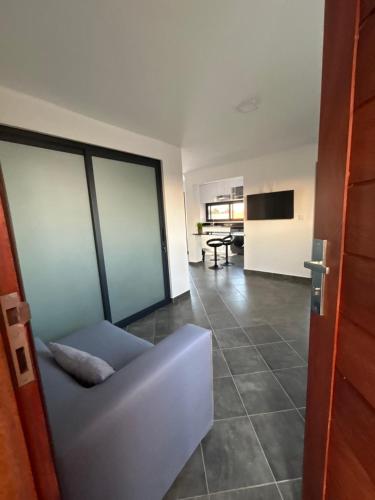 a living room with a couch and a table at Coastal Beach Apartments in Maputo