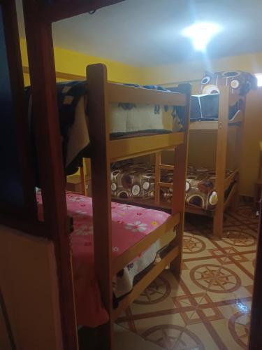 Ένα ή περισσότερα κρεβάτια σε δωμάτιο στο El Amauta de los Andes Lodging Erik House