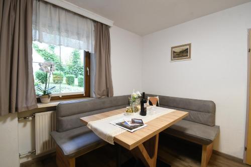 a room with a table and a couch and a window at Haus Stefan in Oetz
