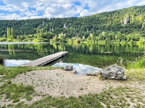 a wooden bridge over a body of water at Holiday Home Tiny Haus Prinz Ludwig by Interhome in Riedenburg