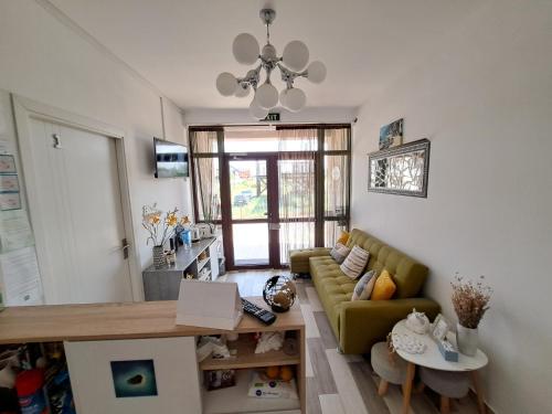 a living room with a couch and a table at Sweet Desire in Vama Veche